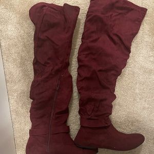 Knee high Burgundy boots.